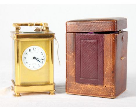 A French carriage timepiece in brass case, circular enamel dial inscribed "Benetfink & Co", 6" high, in leather travelling ca