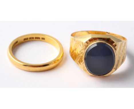 A 22ct gold wedding band, 5.4g, and a signet ring