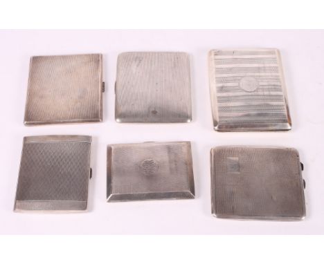 Seven silver cigarette cases with engine turned decoration, 29.1oz troy approx