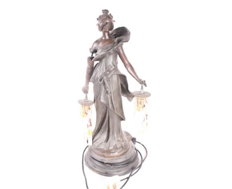 An Art Nouveau style spelter lamp in the form of a young maiden on ebonised plinth, 23" high (a/f)