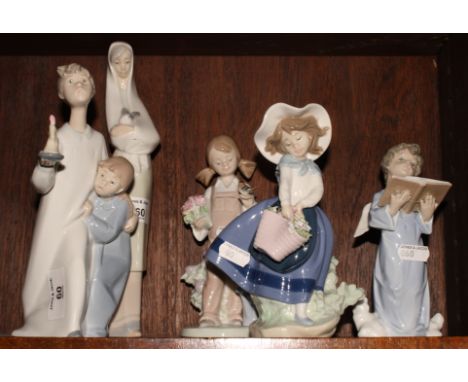 Four Lladro figures of children and a similar Nao figure