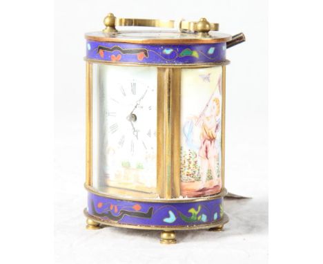 A French carriage timepiece in oval brass case with floral champlevé enamel decoration, porcelain dial inscribed "Elliott & S