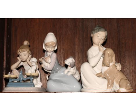 Three Lladro figures of children with cats and dogs