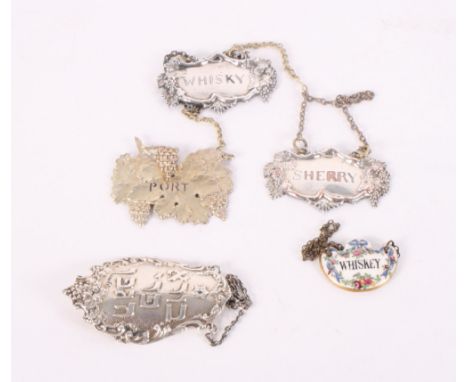 A German 800 grade decanter label with Hebrew script, three plated decanter labels and a Staffordshire pottery decanter label
