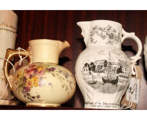 A Royal Worcester squat bulbous jug decorated flowers and a Royal Worcester jug commemorating the bicentenary of the factory