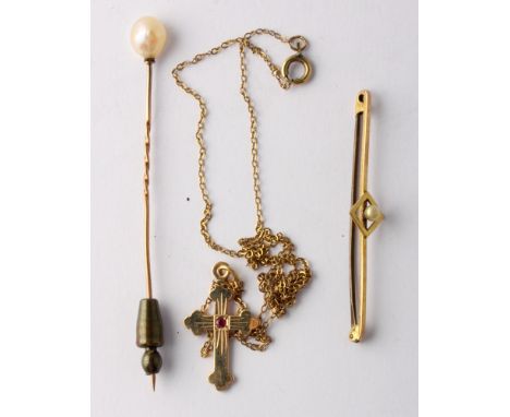 A 10ct gold and ruby crucifix on fine link chain, a 9ct gold and seed pearl bar brooch and a similar stick pin