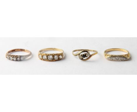 An 18ct gold and diamond five-stone dress ring and three other stone set dress rings