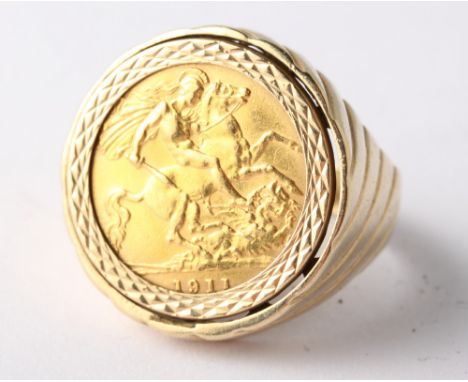A 9ct gold ring set with a 1911 gold half sovereign, 10.6g