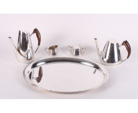 A Danish sterling silver five-piece tea and coffee service with hardwood handles comprising teapot, coffee pot, milk jug, lid