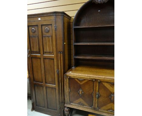 TWO REPRODUCTION OAK CABINETS comprising single drawer wardrobe and arch top dresser, both in the Jacobean-style (2) COLLECTI
