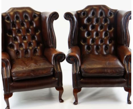 PAIR GEORGIAN-STYLE BROWN LEATHER WINGBACK ARMCHAIRS, by Whittle Bros. of Warrington, button-upholstered backs with loose sea