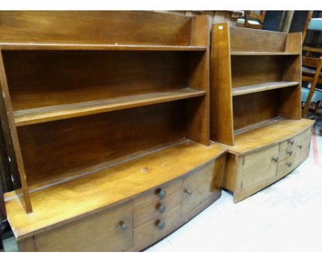 PAIR OF UNUSUAL TEAK LAMINATE HANGING SHELF UNITS with bowed cupboard and drawer bases, 121 x 39 x 111cms (2) COLLECTING ITEM