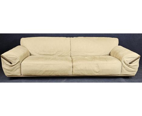 A contemporary Gamma Italian ivory leather three-seater sofa, "Limousine" model with fitted side magazine pouches. H.72 W.255
