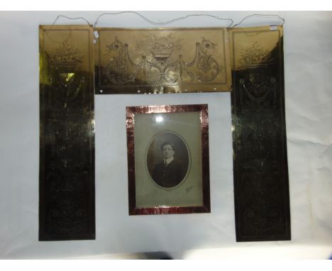 A good quality late 19th/early 20th century beaten copper frame containing a portrait photograph of a young man, marked DURAY