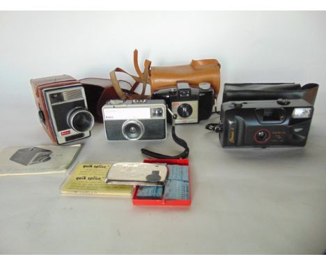 Several vintage cameras to include a Kodak Brownie 127, a Kodak Instamatic 33, and a Kodak 8 Movie camera, etc
