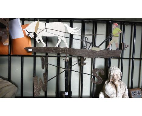 A weather vane, the cut sheet metal finial in the form of a horse drawn plough with painted finish