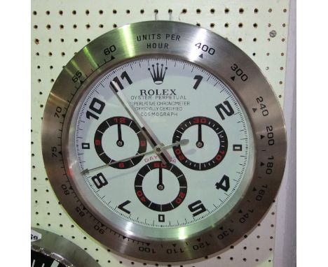 A Rolex wall clock, the dial in the form of the Oyster Perpetual Chronometer within a brushed aluminium bezel, 35 cm diameter