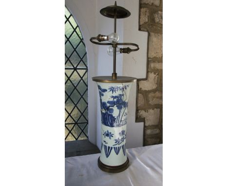 A 19th century oriental blue and white vase of cylindrical form with painted floral and tree decoration 41cm tall, converted 