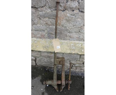 A vintage cast iron leg vice
