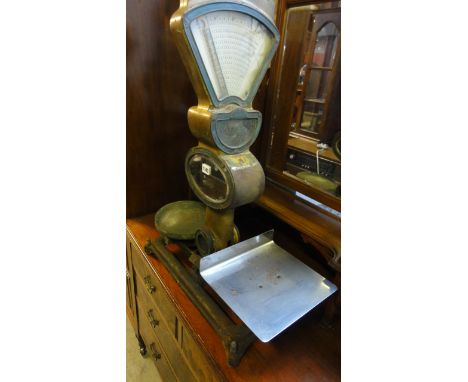 Two vintage Avery grocers weighing scales together with one other by the Automatic Scale Company Ltd, London and Manchester