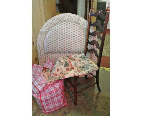 A single upholstered bed head board of arched form, together with a country made tall ladder back single chair with string se