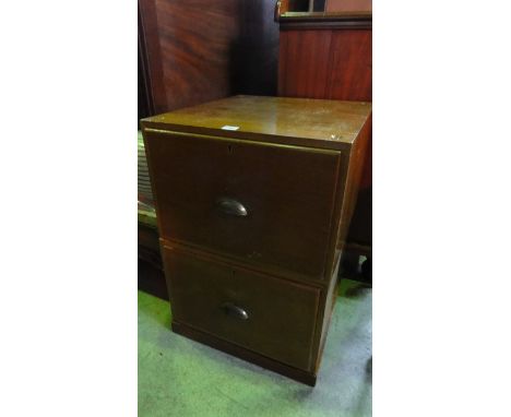 A vintage teak two sectional low two drawer pedestal filing cabinet with brass cup handles