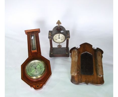 An inlaid Edwardian mahogany aneroid barometer, a small portico clock with eight day striking movement and a beechwood hall m