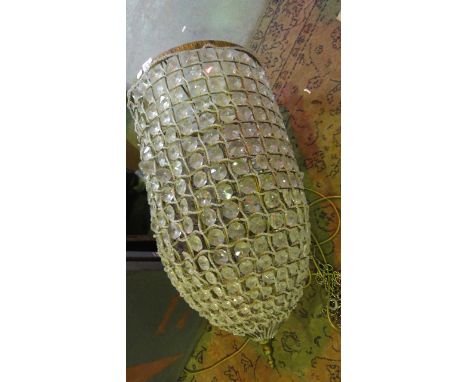 A large contemporary hanging ceiling bag type light of cylindrical and tapered form with drop finial, the lattice gilt colour