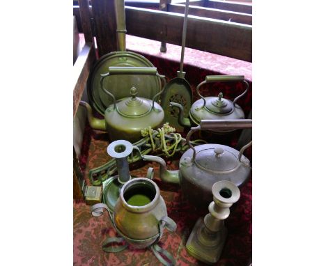 Antique metal wares to include three Victorian copper kettles, a warming pan, candlestick, chamber stick etc