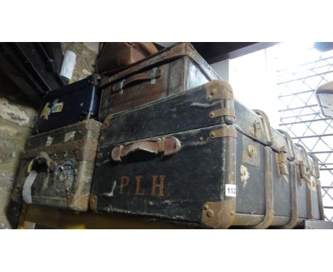One lot of vintage luggage to include a lathe bound and fibre trunk, stitched brown leather suitcase, Gladstone type bag, etc
