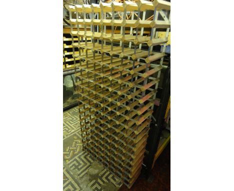 A contemporary steel bound and pine divisional wine rack to hold 136 bottles