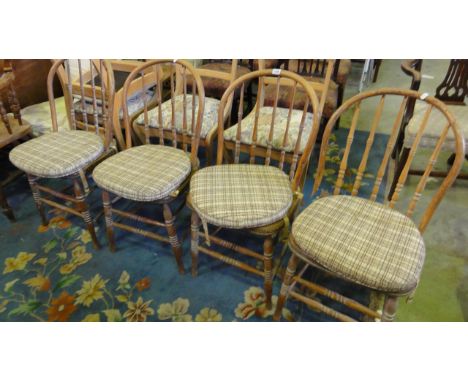 A set of four hoop and stick back dining chairs in ash and beech, with turned spindle backs and ring turned and tapered suppo