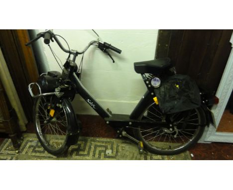 A Solex motorised bicycle with 49 cc petrol engine mounted on the front wheel