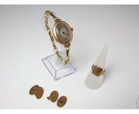 A vintage ladies wristwatch with 9ct gold oval casework (plated strap), 9ct gold signet ring and a pair of 9ct gold cuff link