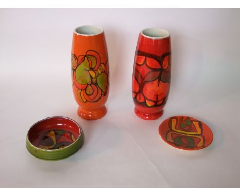 A collection of Poole Pottery wares including two vases of curved cylindrical form with abstract decoration on orange and red