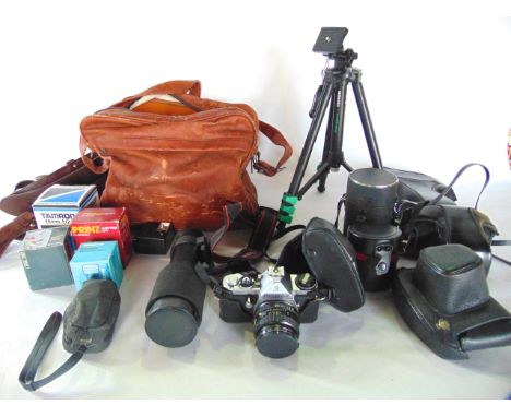 A selection of 20th century cameras and photographic effects to include Pentax and other cameras, an Optimax lens unit, a tel