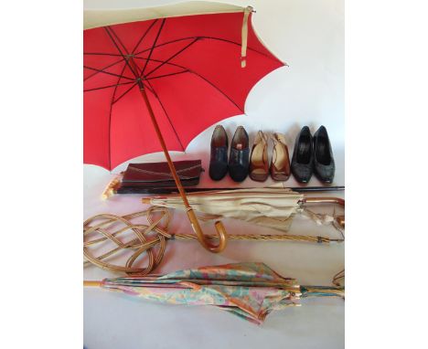 A 19th century  carved ebony and ivory mounted walking stick, three vintage umbrellas, a carpet beater, a collection of vinta