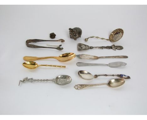 A collection of small silver plated flatware