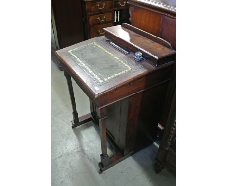 A late Victorian mahogany davenport with shallow hinged box stationery compartment, inkwell, pen tray and leather panelled sl