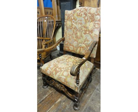 A 19th century continental elbow chair, the framework with acanthus and other detail raised on turned supports and with pierc