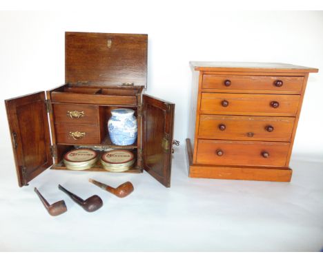 A vintage stained pine miniature bank of four graduating drawers, 32cm tall by 29 cm wide max, together with a small oak smok