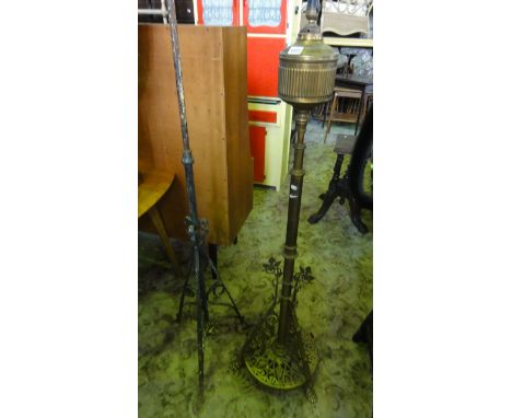 A late Victorian gothic revival cast brass telescopic oil lamp standard (later converted to electricity), with pierced foliat