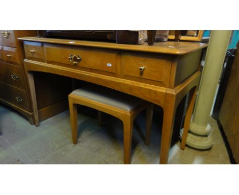 A medium to light oak Stag dressing table with triple mirror back over three frieze drawers, raised on square tapered support