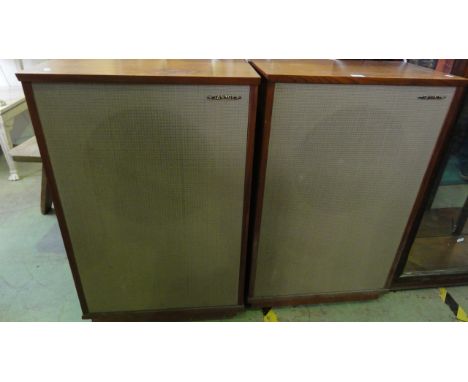A pair of vintage teak framed and floor standing Tannoy speakers with applied paper labels to reverse, type L8U/HF/15/8 seria