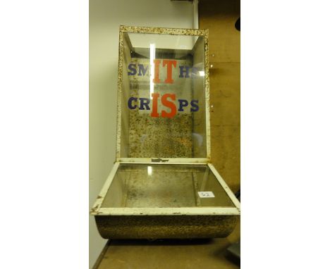 A vintage wall mounted shop cabinet/dispenser partially glazed and painted advertising Smiths crisps