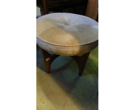 A vintage G Plan Fresco dressing stool with central button upholstered circular seat, raised on shaped supports united by a c