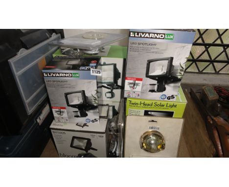 One lot of boxed unused lighting to include two Livarno Lux LED spot lights, twin head solar light with PIR (passive infra re