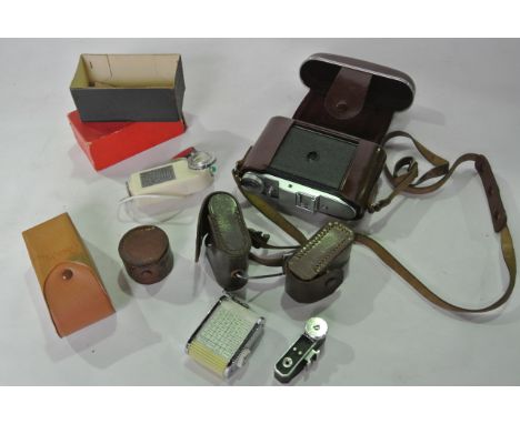 Vintage photographic equipment to include a cased 20th century German camera together with a boxed flash gun