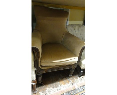 A late Regency/William IV library chair with shaped and scrolled outline, partially upholstered with loose cushion and show w