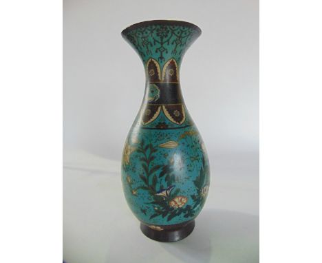 An antique Chinese cloisonné enamel vase of tapering cylindrical form with flared rim, the sky blue ground interspersed with 